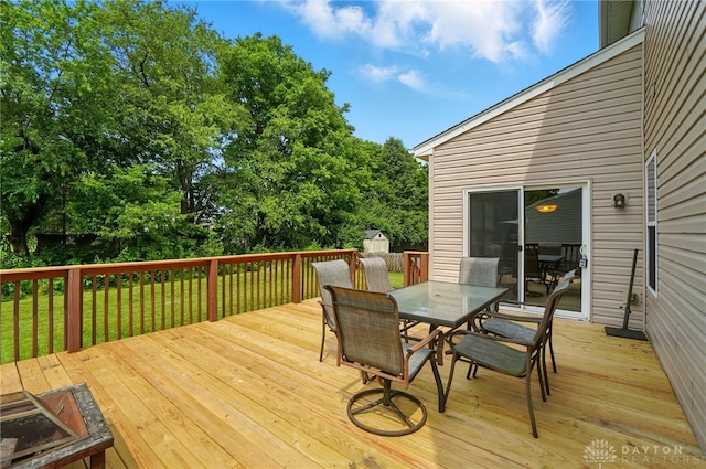 1956 Daffodil Dr, Xenia, OH 45385 - wooden terrace featuring outdoor dining space and a lawn
