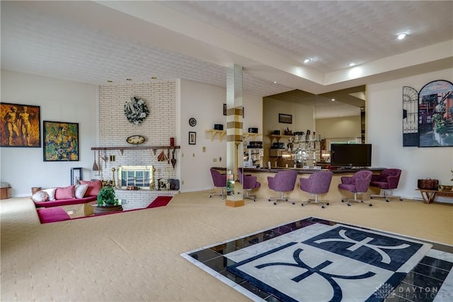 1952 Tait Circle Rd, Dayton, OH 45429 - living room featuring carpet floors, recessed lighting, and a brick fireplace