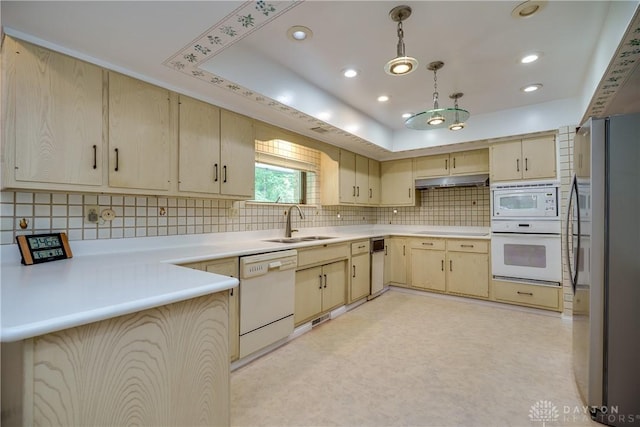 1952 Tait Circle Rd, Dayton, OH 45429 - kitchen with white appliances, light brown cabinets, decorative backsplash, light countertops, and under cabinet range hood