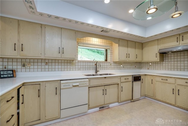 1952 Tait Circle Rd, Dayton, OH 45429 - kitchen with white dishwasher, light brown cabinetry, under cabinet range hood, stovetop, and light countertops