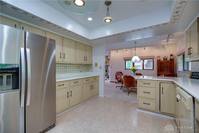 1952 Tait Circle Rd, Dayton, OH 45429 - kitchen featuring stainless steel fridge, white dishwasher, light countertops, and cream cabinetry