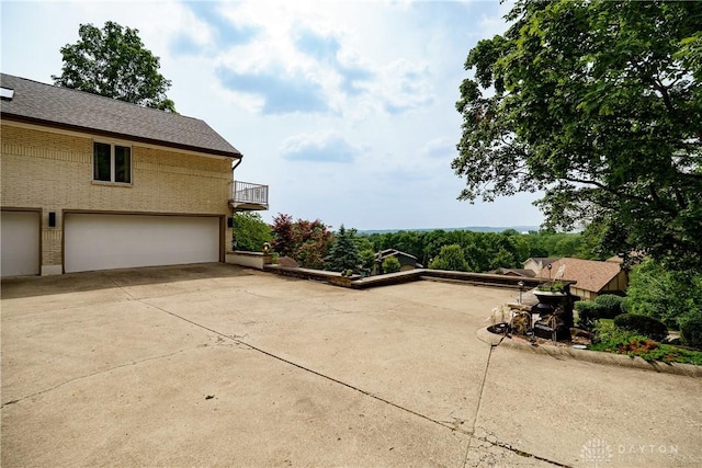1952 Tait Circle Rd, Dayton, OH 45429 - patio / terrace featuring an attached garage and concrete driveway