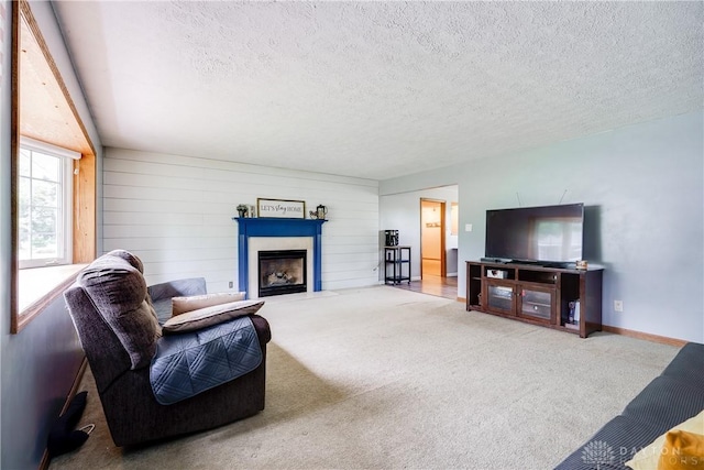 1864 E Lytle 5 Points Rd Unit R, Centerville, OH 45458 - living area featuring carpet flooring, a fireplace with flush hearth, and a textured ceiling