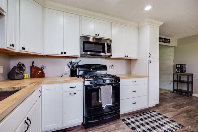 1864 E Lytle 5 Points Rd Unit R, Centerville, OH 45458 - kitchen featuring stainless steel microwave, black gas range oven, wooden counters, dark wood finished floors, and recessed lighting