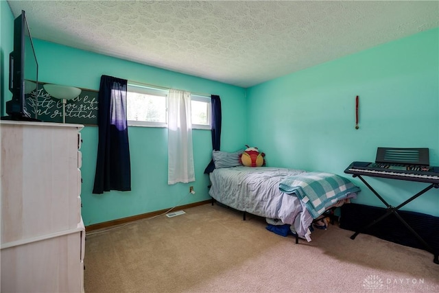 1864 E Lytle 5 Points Rd Unit R, Centerville, OH 45458 - bedroom with a textured ceiling and carpet flooring