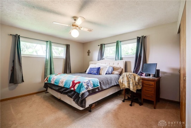 1864 E Lytle 5 Points Rd Unit R, Centerville, OH 45458 - carpeted bedroom with multiple windows, a textured ceiling, and a ceiling fan