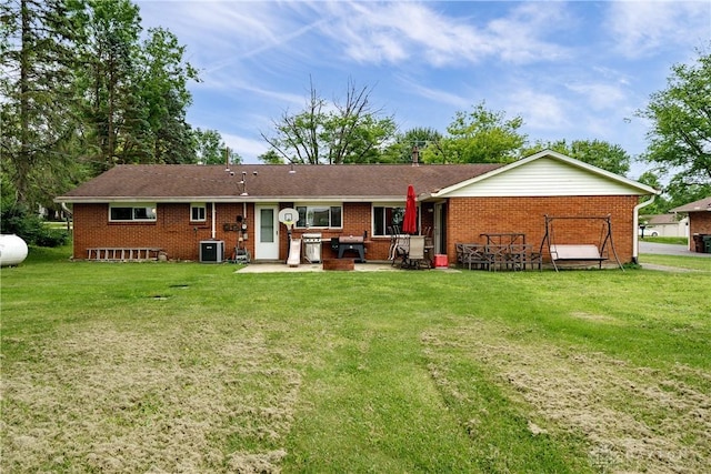 1864 E Lytle 5 Points Rd Unit R, Centerville, OH 45458 - back of property featuring a patio, brick siding, and a lawn