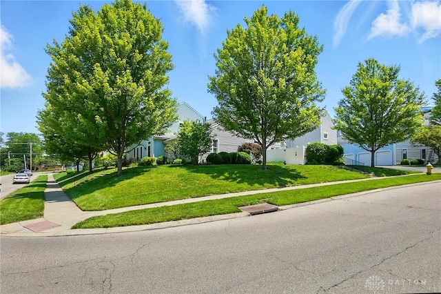 3127 Gracemore Ave, Kettering, OH 45420 - obstructed view of property featuring a front yard and a garage