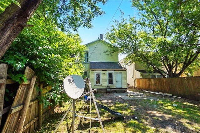 57 S Torrence St, Dayton, OH 45403 - back of property featuring entry steps and a shingled roof