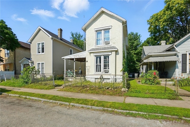 57 S Torrence St, Dayton, OH 45403 - view of front of house featuring brick siding, a fenced front yard, covered porch, cooling unit, and a gate