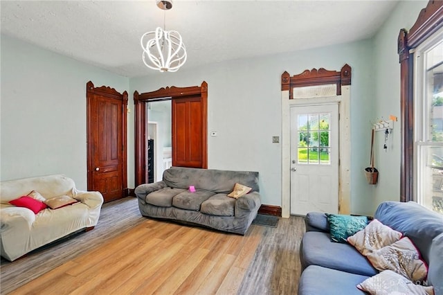 57 S Torrence St, Dayton, OH 45403 - living room featuring a chandelier and light wood-style floors