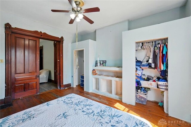 57 S Torrence St, Dayton, OH 45403 - bedroom with hardwood / wood-style floors, a closet, and a ceiling fan