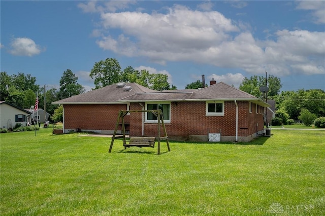 3372 Home Acres Ave, Beavercreek, OH 45431 - back of property featuring a yard and brick siding
