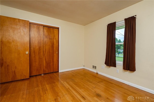 3372 Home Acres Ave, Beavercreek, OH 45431 - unfurnished bedroom featuring wood finished floors and a closet