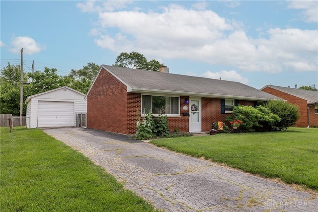 2151 Newgate Ave, Dayton, OH 45420 - view of front facade with brick siding, an outdoor structure, a detached garage, asphalt driveway, and a front yard