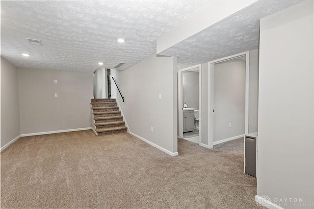 6814 Rushleigh Rd, Englewood, OH 45322 - finished basement featuring carpet, stairway, a textured ceiling, and recessed lighting