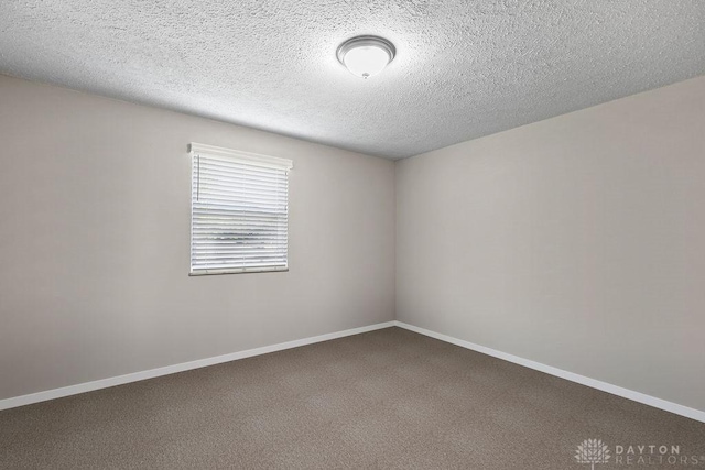 6814 Rushleigh Rd, Englewood, OH 45322 - spare room featuring carpet floors and a textured ceiling