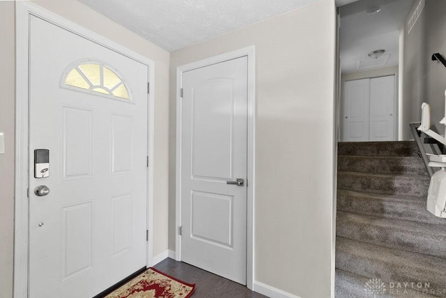 6814 Rushleigh Rd, Englewood, OH 45322 - foyer featuring dark wood-style flooring and stairway
