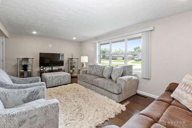 6814 Rushleigh Rd, Englewood, OH 45322 - living room featuring wood finished floors and recessed lighting