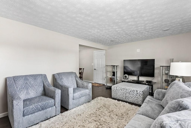 6814 Rushleigh Rd, Englewood, OH 45322 - living room featuring wood finished floors and a textured ceiling