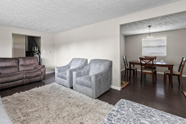 6814 Rushleigh Rd, Englewood, OH 45322 - living room featuring a textured ceiling and wood finished floors