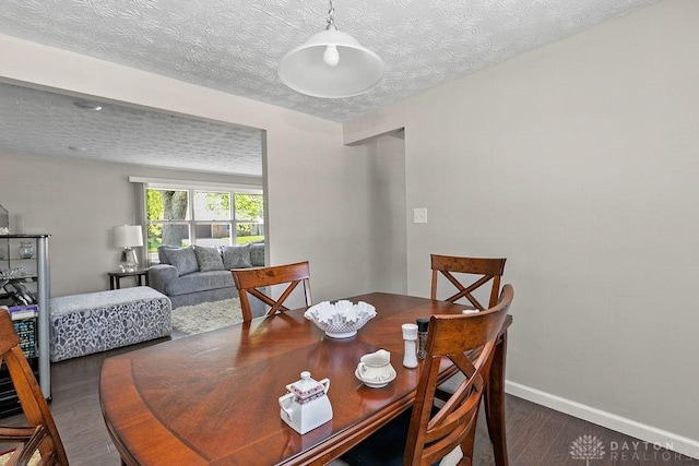 6814 Rushleigh Rd, Englewood, OH 45322 - dining room featuring wood finished floors and a textured ceiling