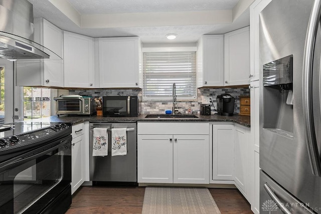 6814 Rushleigh Rd, Englewood, OH 45322 - kitchen featuring black appliances, wall chimney range hood, backsplash, dark wood-style floors, and white cabinets