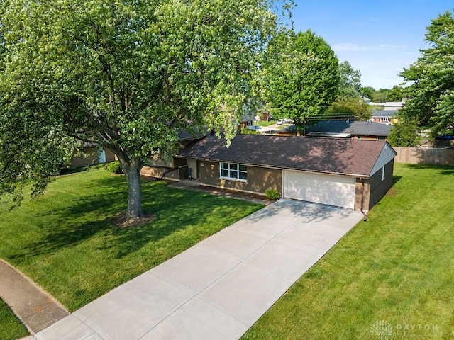 6814 Rushleigh Rd, Englewood, OH 45322 - view of front of property featuring concrete driveway, an attached garage, and a front yard
