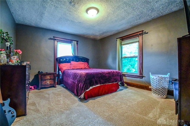 2457 Wilbraham Rd, Middletown, OH 45042 - bedroom with multiple windows, a textured ceiling, and carpet floors