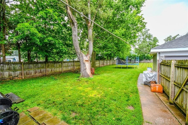 2457 Wilbraham Rd, Middletown, OH 45042 - fenced backyard featuring a trampoline