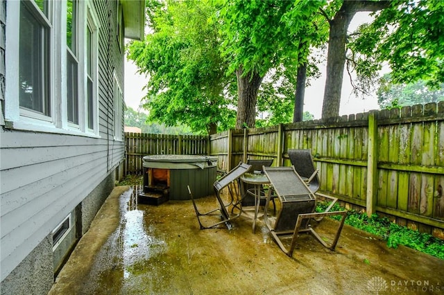 2457 Wilbraham Rd, Middletown, OH 45042 - fenced backyard featuring a hot tub and a patio area