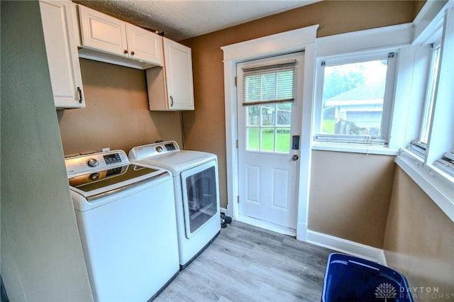 2457 Wilbraham Rd, Middletown, OH 45042 - laundry area with independent washer and dryer, light wood finished floors, and cabinet space