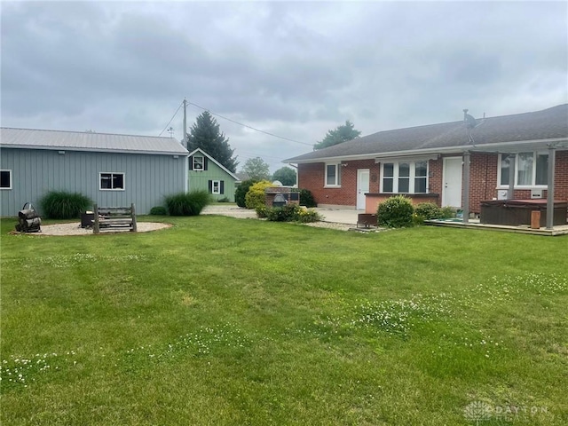 311 Swailes Rd, Troy, OH 45373 - view of grassy yard featuring a hot tub