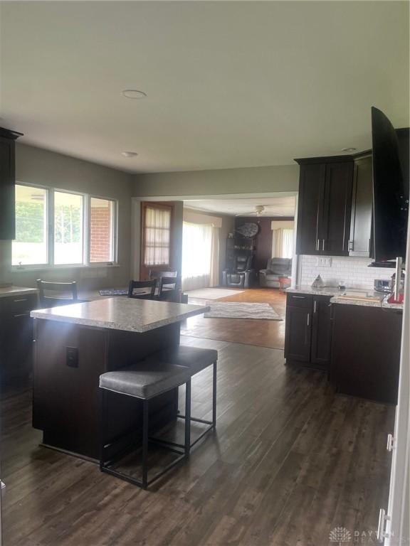 311 Swailes Rd, Troy, OH 45373 - kitchen with plenty of natural light, a center island, and dark wood-type flooring