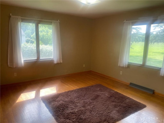 311 Swailes Rd, Troy, OH 45373 - spare room featuring plenty of natural light and wood finished floors
