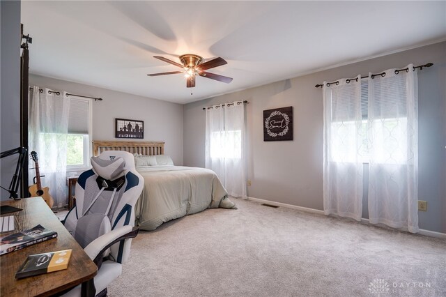 8282 Hile Ln, Germantown, OH 45327 - bedroom with multiple windows, ceiling fan, and carpet