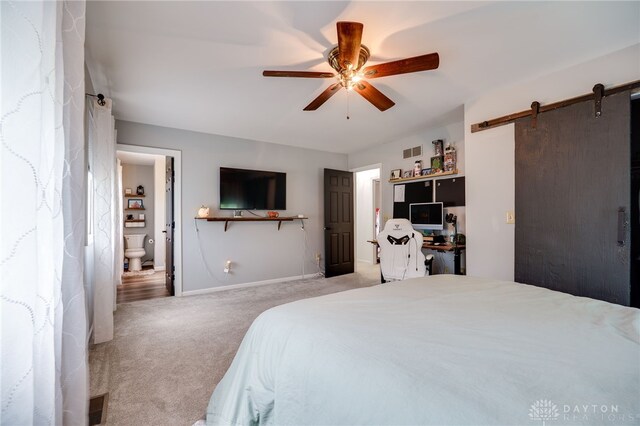 8282 Hile Ln, Germantown, OH 45327 - carpeted bedroom featuring a barn door and ceiling fan