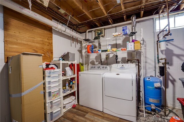 8282 Hile Ln, Germantown, OH 45327 - washroom with washer and clothes dryer, wood finished floors, and concrete block wall