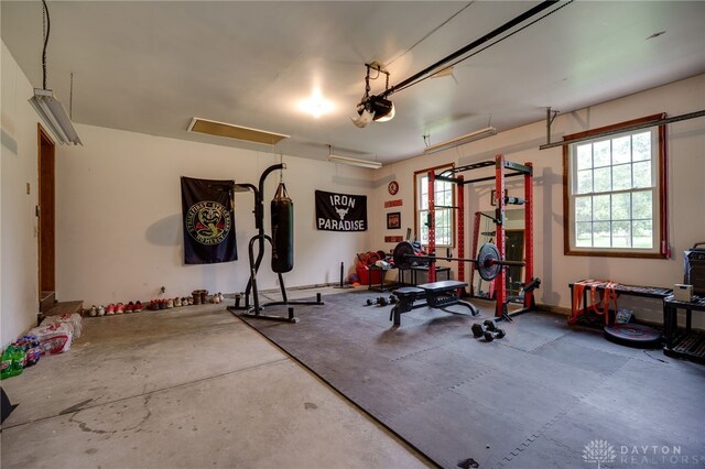 8282 Hile Ln, Germantown, OH 45327 - workout room featuring healthy amount of natural light and a garage