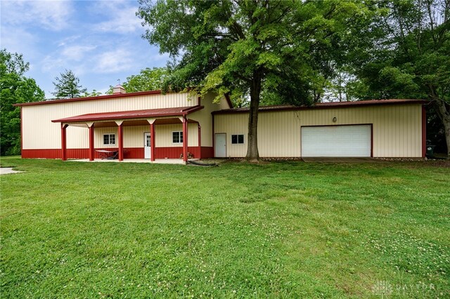 8282 Hile Ln, Germantown, OH 45327 - view of front of property with a front yard, a chimney, and a garage
