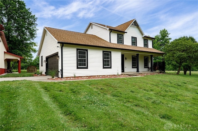 8282 Hile Ln, Germantown, OH 45327 - view of front of house featuring covered porch, a front yard, concrete driveway, and a garage