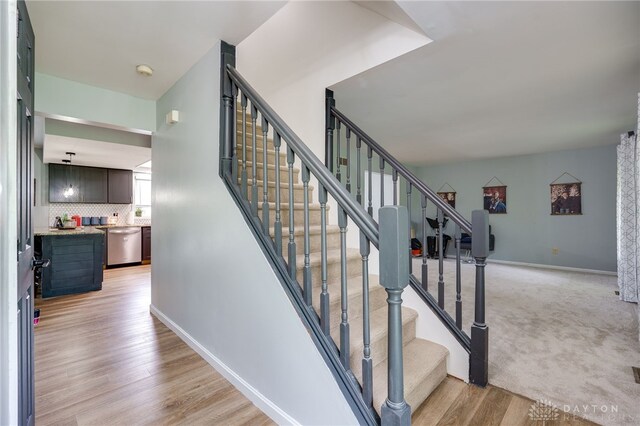 8282 Hile Ln, Germantown, OH 45327 - stairway with baseboards and wood finished floors