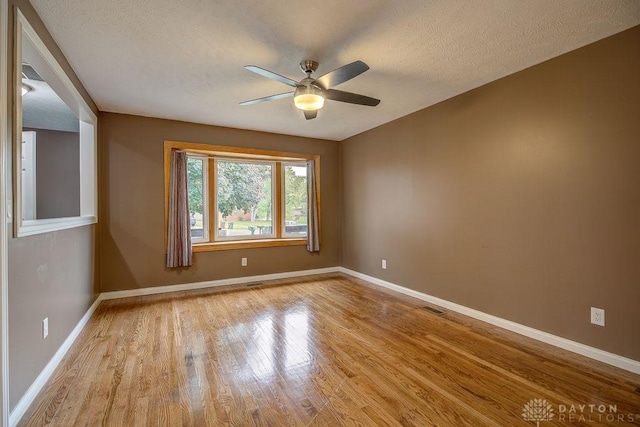 5807 Twin Pine Ln, Miami Twp, OH 45449 - unfurnished room with a ceiling fan, wood finished floors, and a textured ceiling