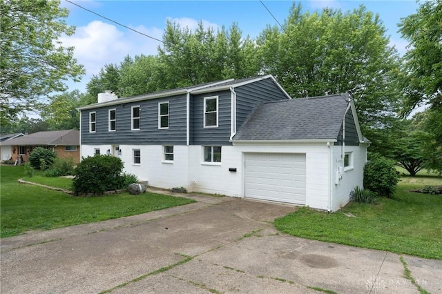 1189 Spinning Rd, Dayton, OH 45432 - view of front of home with a garage, a front yard, driveway, a chimney, and a shingled roof