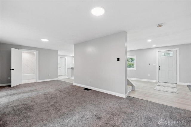 1189 Spinning Rd, Dayton, OH 45432 - unfurnished living room featuring carpet floors, recessed lighting, and stairs