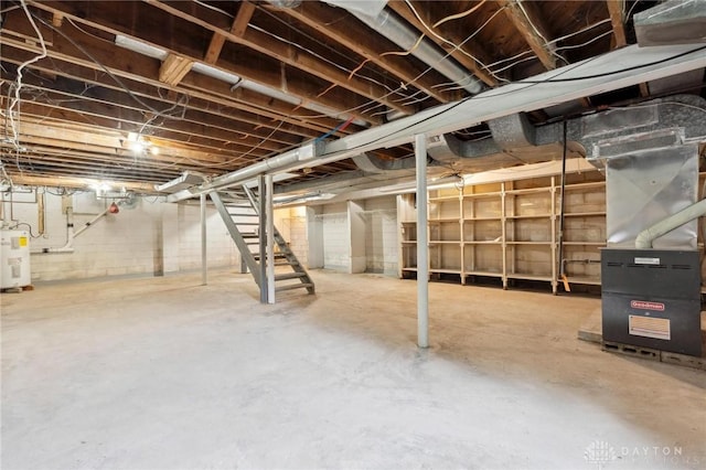 1189 Spinning Rd, Dayton, OH 45432 - unfinished below grade area featuring stairs, electric water heater, and heating unit