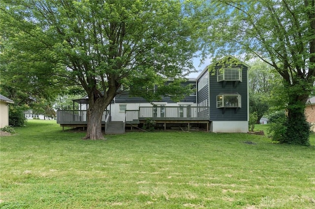 1189 Spinning Rd, Dayton, OH 45432 - back of house with a wooden deck and a lawn