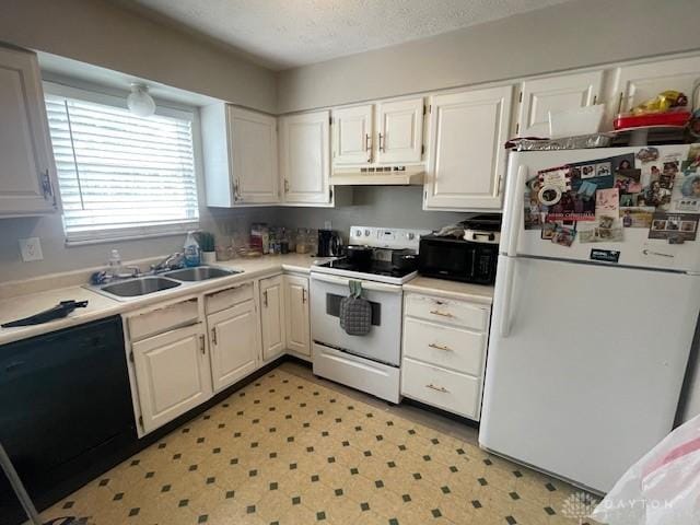 1616 Belvo Rd Unit 1610, Miamisburg, OH 45342 - kitchen with white appliances, under cabinet range hood, white cabinets, light countertops, and light floors