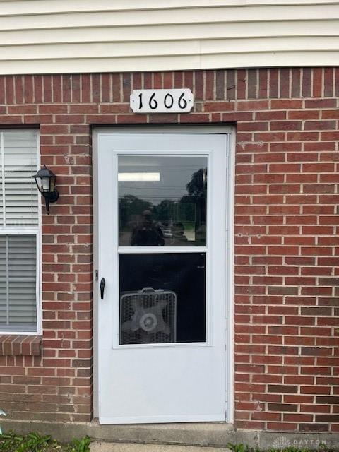 1608 Belvo Rd Unit 1602, Miamisburg, OH 45342 - view of exterior entry featuring brick siding