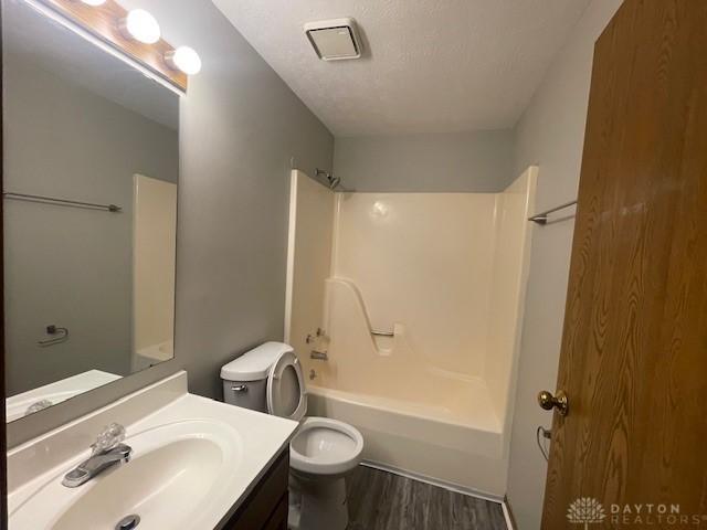 1608 Belvo Rd Unit 1602, Miamisburg, OH 45342 - full bath featuring wood finished floors, vanity, and tub / shower combination